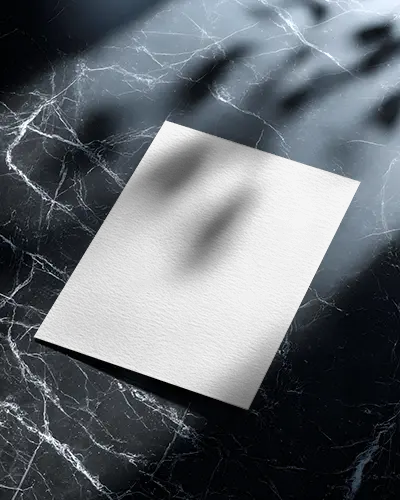 Minimalistic Flyer Mockup Showcasing Paper Texture On Marble Background Under Soft Light