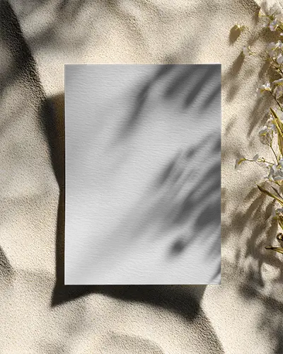 Shadow Cast Minimalist Flyer Mockup On Textured Surface With Natural Floral Elements Around