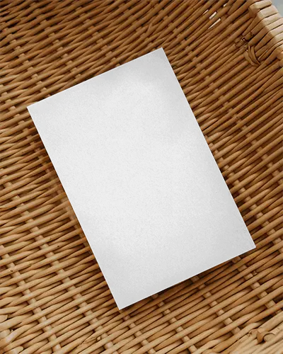 Vertical Flyer Mockup Placed On Crafted Wicker Rattan Surface For Presentation