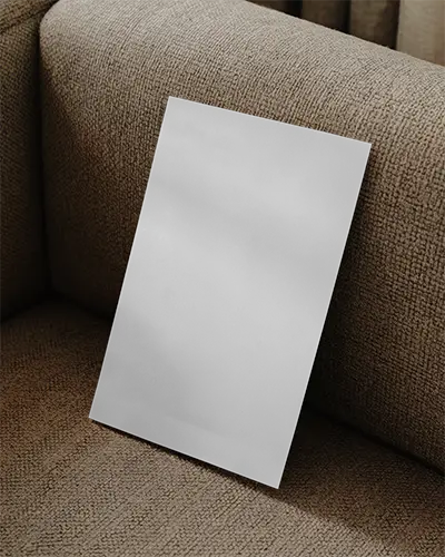 Minimalistic Flyer Mockup Placed On Cozy Sofa For Business And Event Advertising Projects