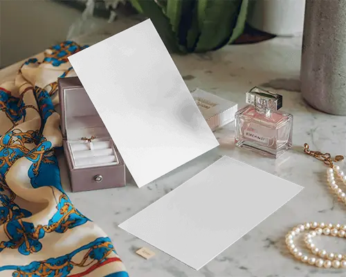 Minimalist Perfume Display Flyer Mockup White Paper On Counter With Perfume Box And White Tile Background Clean And Modern Aesthetic 066