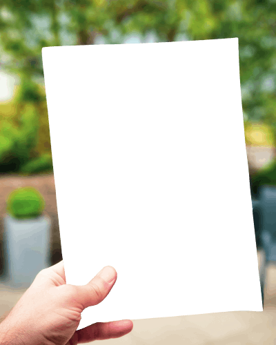 Hand Holding A Flyer Mockup Having Garden In Background