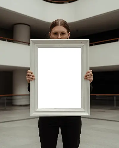 Woman Holding Large Blank Picture Frame Mockup For Showcasing Custom Artwork Display Online
