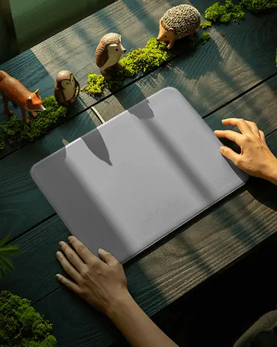 Forest Desk Gaming Pad Mockup With Woodland Figures And Soft Sunbeams