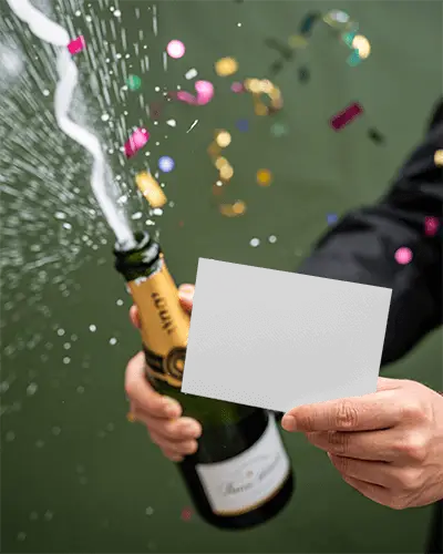 New Year Celebration Card Mockup With Sparkling Champagne Bottle And Confetti Explosion Design