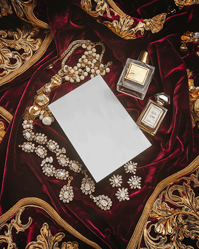 royal-greeting-card-mockup-opulent-velvet-background-with-gold-jewelry-and-elegant-perfume-bottles
