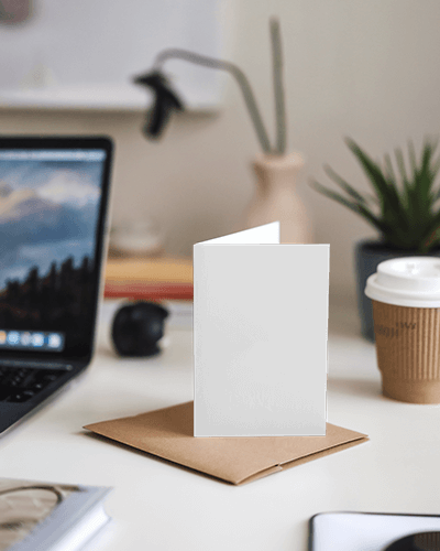Modern Greeting Card Mockup Elegant Folded Card On Desk With Envelope And Cozy Workspace