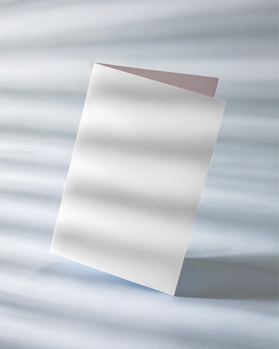 Soft Light Greeting Card Mockup Standing Card On Textured Surface With Natural Shadowing Elegant And Minimalist Design Showcase