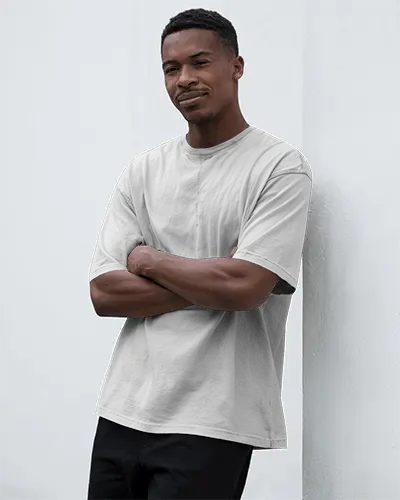 Natural Light Photoshoot T Shirt Mockup Young Man Front Facing In Neutral Indoor Setting