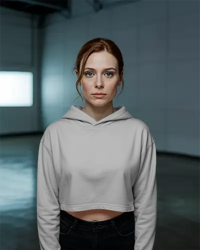 mid-age-casual-cropped-hoodie-mockup-on-woman-standing-against-modern-industrial-background