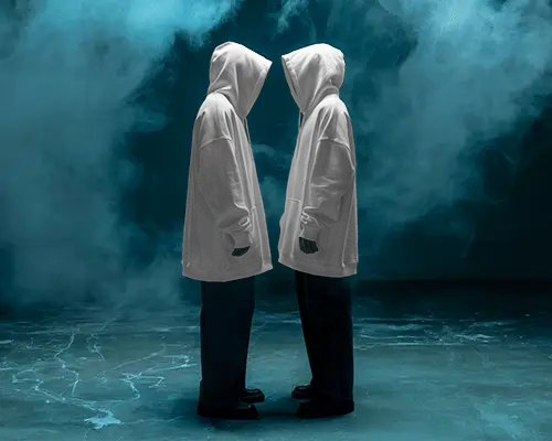 Cinematic Dual Hoodie Mockup Two Figures Facing Each Other In Moody Smoke Filled Ambience