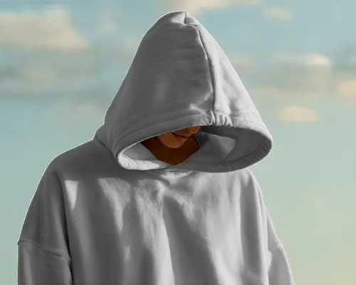 Outdoor Editorial Hoodie Mockup Mysterious Model With Hood Up Against Soft Cloudy Sky