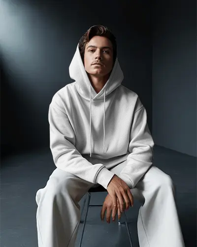 Premium Soft Fabric Hoodie Mockup With Hood Up Seated Male Model For Clothing Marketing