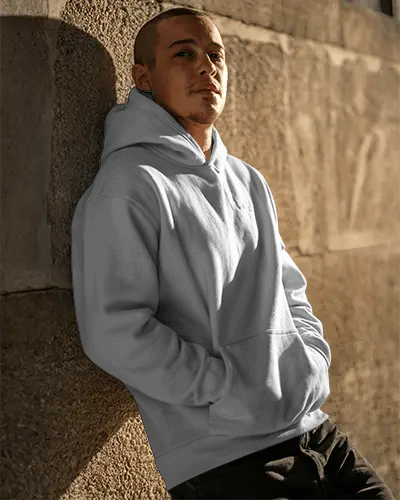 Men Comfortable Hoodie Mockup Near Textured Wall For Fashion Brand Promotion