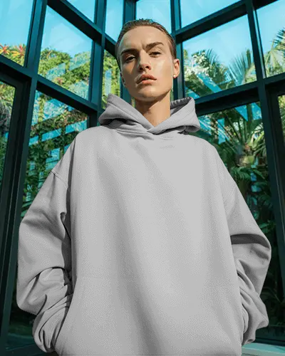 Botanical Urban Hoodie Mockup Featuring Cool Model Surrounded By Tropical Plants