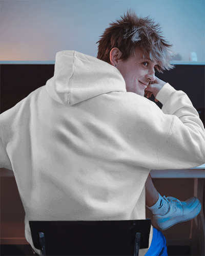 Gym Inspired Hoodie Mockup Young Model In Dimly Lit Creative Environment