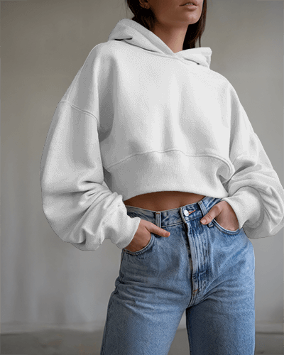 Minimalist Cropped Hoodie Mockup Female Model In High Waisted Denim With Modern Graphic Design
