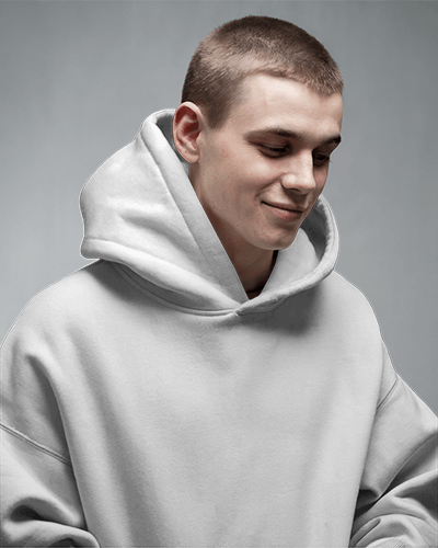 Minimalist Hoodie Mockup Smiling Male Model In Soft Lighting Neutral Gray Background Cozy And Modern Casual Look