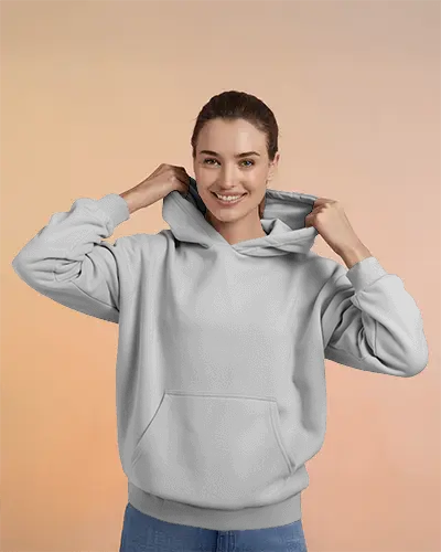 Female Model Showcasing Hoodie Mockup Against Peach Background