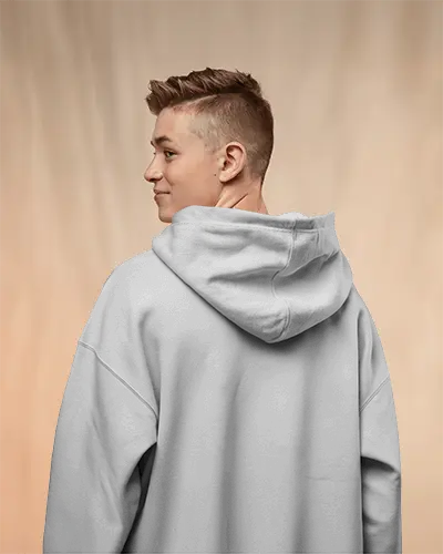 Back View Hoodie Mockup With Smiling Young Male Model In Soft Studio Lighting And Neutral Background