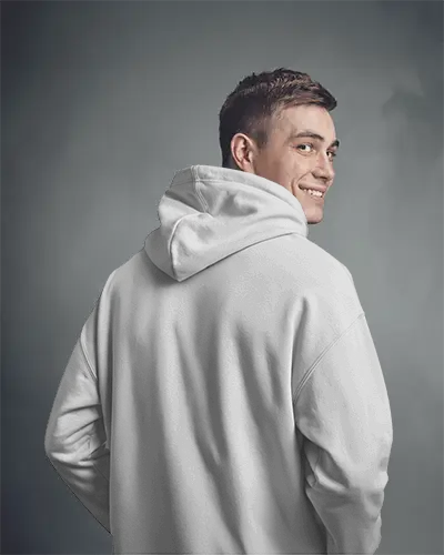 Back View Hoodie Mockup With Smiling Male Model In White Hoodie Against Minimal Gray Studio Background