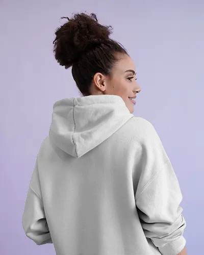 Pastel Studio Hoodie Mockup With Smiling Female Model Showing In Light Purple Background