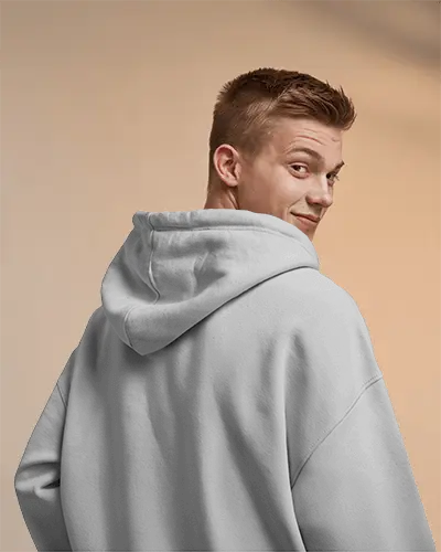 Back View Hoodie Mockup On Smiling Model With Warm Neutral Background