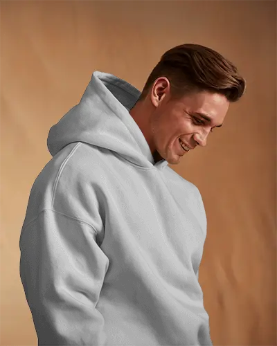Natural Mood Hoodie Mockup Smiling Guy In Hoodie Against Beige Fabric Background