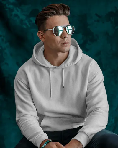 Stylish Male Hoodie Mockup Model In Hoodie And Sunglasses On Teal Textured Backdrop