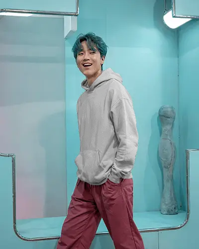 Pastel Blue Studio Hoodie Mockup Male Model Smiling In Modern Playful Setting