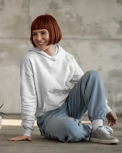 Natural Light Hoodie Mockup Young Woman Smiling In Soft Shadowed Space