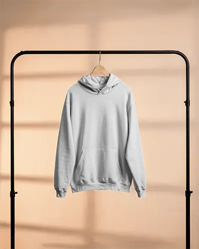 Pastel Lit Hoodie Mockup Hanging On Wooden Hanger Against Warm Studio Background