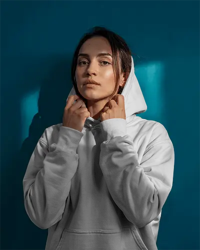Bold Female Portrait Hoodie Mockup In Studio Lighting Against Deep Teal Background Modern And Minimalist Fashion Scene 0522