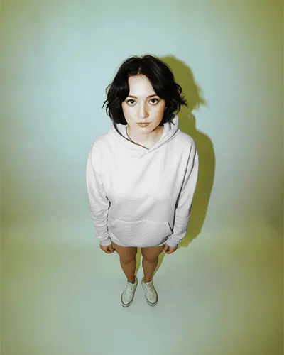 Sculptural Oversized Hoodie Mockup Draped On Pedestal As Wearable Art Gallery Lighting With Dramatic Shadow Play