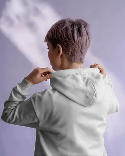 Hoodie Mockup With Back Design And Female Model In Bright Interior Under Subtle Shadow Light Play 0529