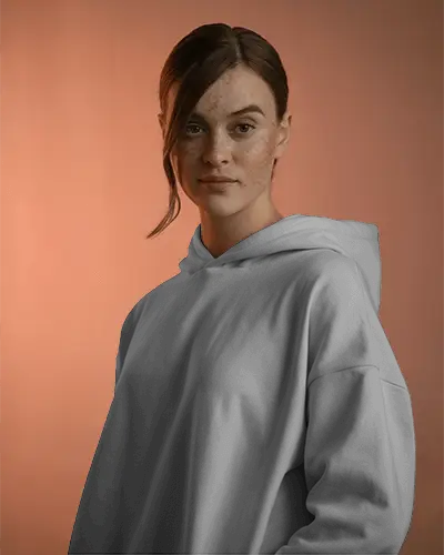 Urban Wear Female Hoodie Mockup Presented By Model In Pastel Studio For A Trendy Vibe