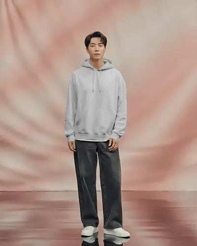 Clean White Hoodie Mockup On Modern Asian Male Model With Soft Blurred Background Perfect For Minimalist Branding And Apparel Launches