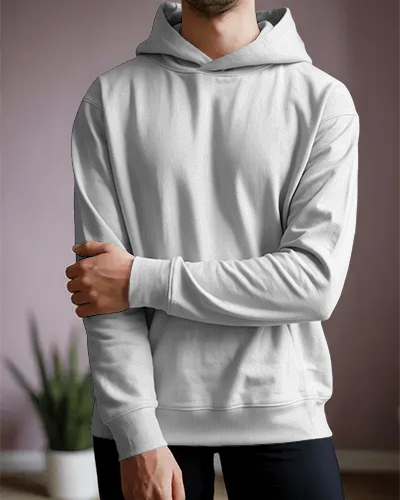 Realistic Hoodie Mockup Featuring Male Model In Cozy Indoor Space