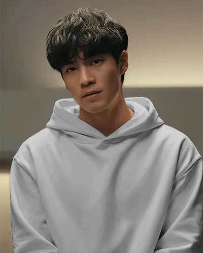 White Hoodie Mockup On Asian Male Model With Soft Warm Lighting Background