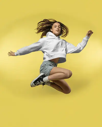 Dynamic Jump Cropped Hoodie Mockup Female Model In Motion On Yellow Background