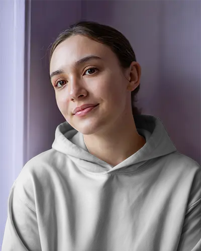 Close Up White Hoodie Mockup Female Model Relaxed Pose Purple Wall Soft Light Front Design View