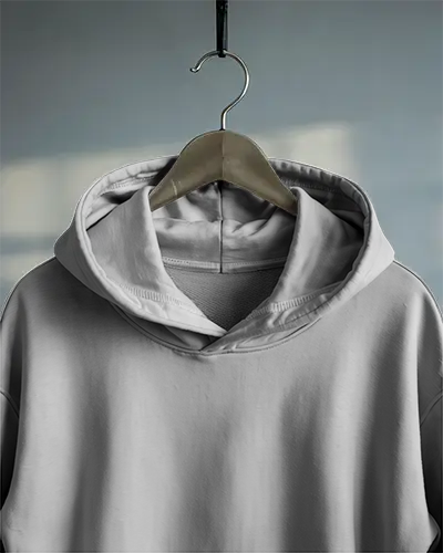 White Hoodie Mockup Hanging On Wooden Hanger Close Up Front View Subtle Sky Reflection Background Soft Light Realistic Texture Design Centered