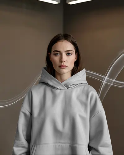 Moody Indoor Hoodie Mockup Female Model Front View Soft Lighting With Subtle Smoke Lines Modern And Minimal Style
