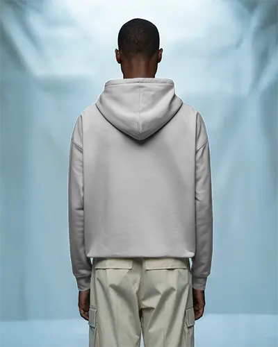 Back View Hoodie Mockup Male Model In White Hoodie On Soft Blue Studio Background