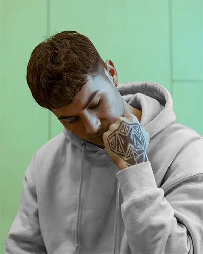 Indoor Hoodie Design Showcase With Young Man And Artistic Tattoos