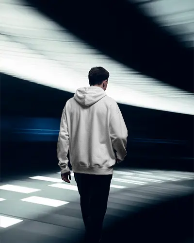Dynamic Hoodie Mockup With Man In Motion Through Futuristic Hallway