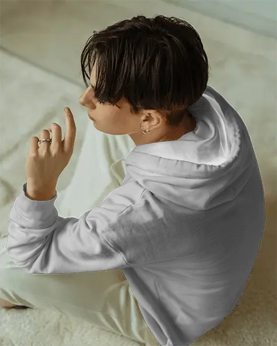 Casual Indoor White Hoodie Mockup Female Model Sitting On Cream Carpeted Floor In Soft Natural Light Modern Style 0702