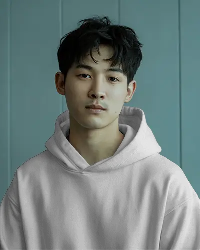 Lifestyle Hoodie Mockup Young Man Posing Indoors Modern Lighting With Neutral Minimalist Background