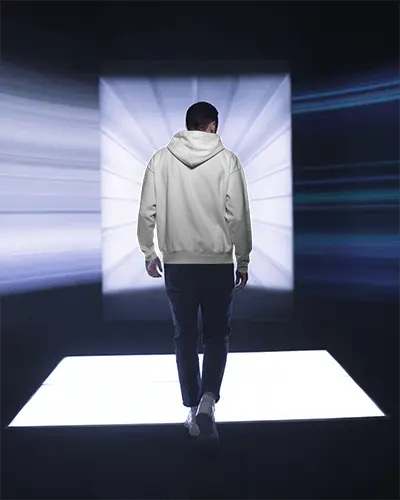 Backview Hoodie Mockup Male Model Walking Towards Illuminated White Square Platform 0768