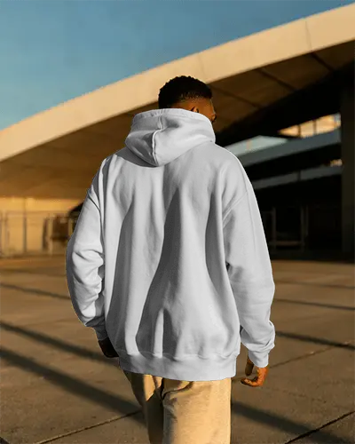 Sunlit Urban Hoodie Mockup Male Model Walking Away On Modern Architectural Structure Scenery 0787